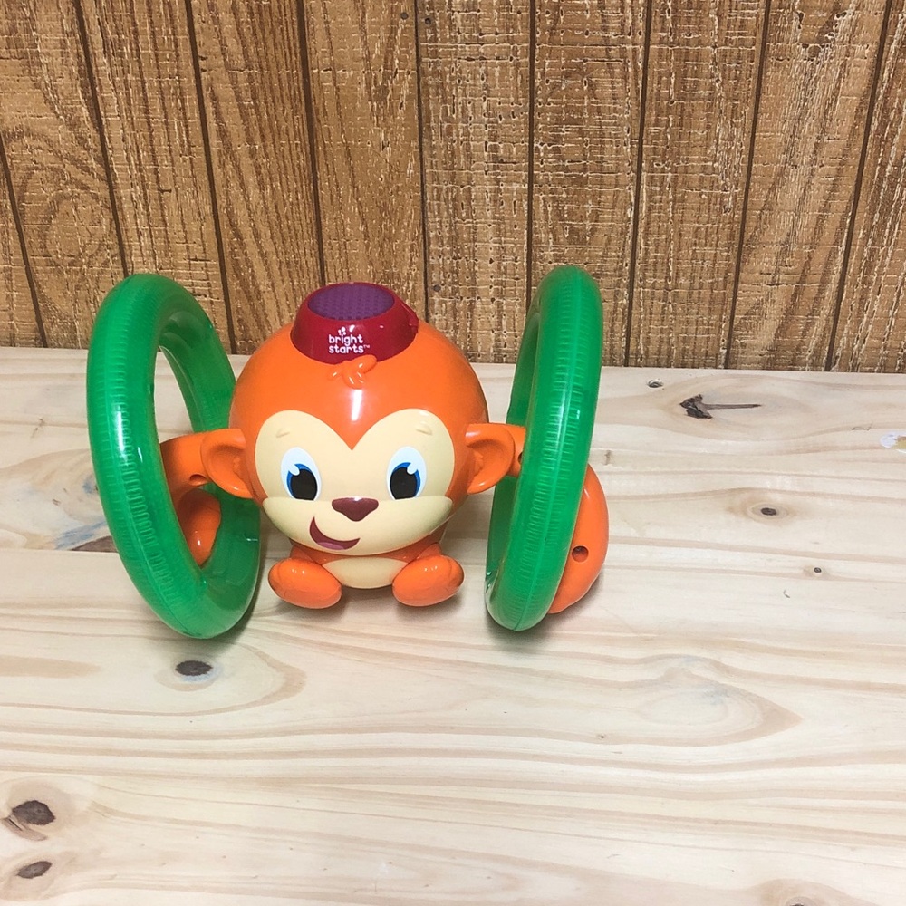 Bright Starts Orange Monkey Rolling Learning Toy with Green Rings